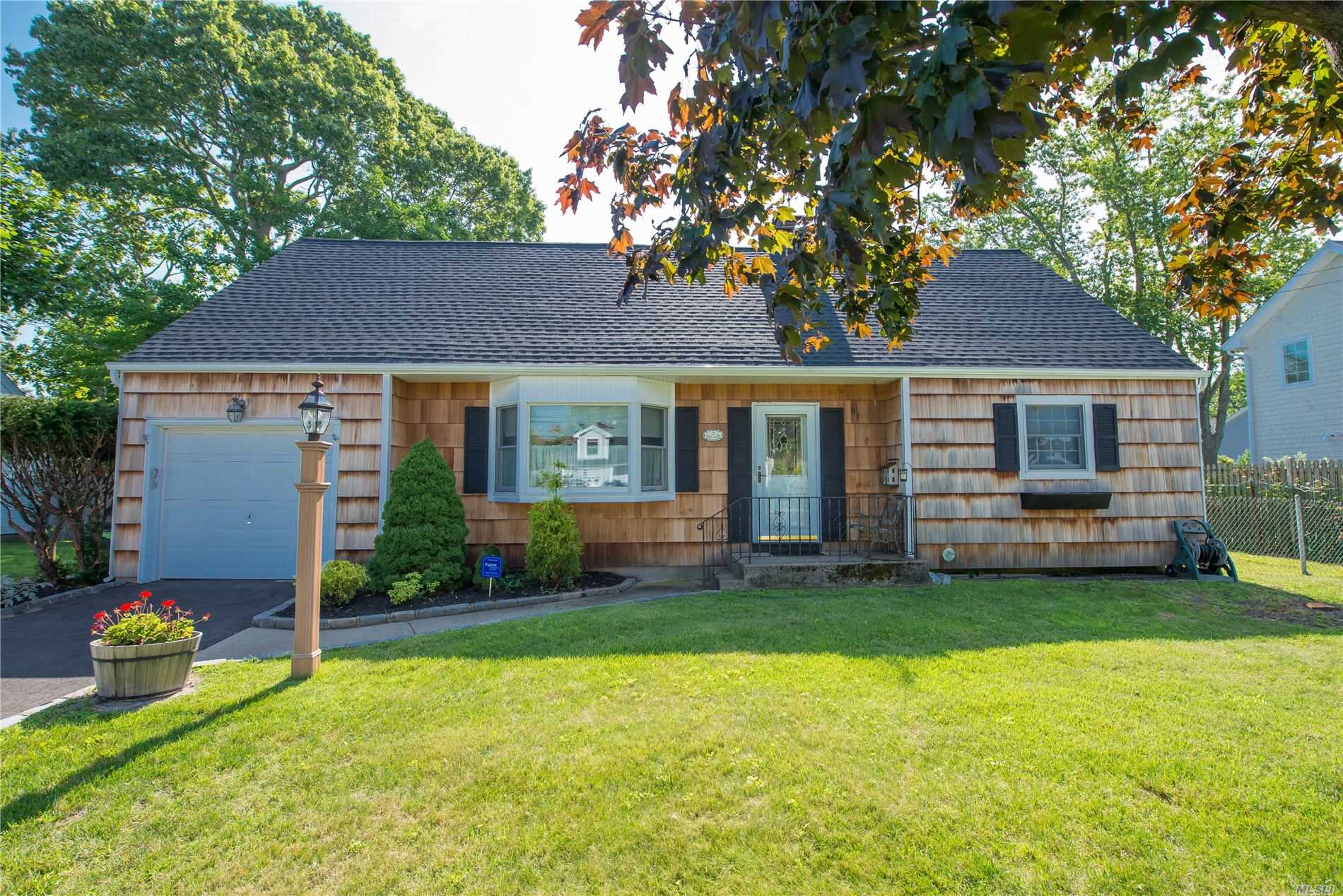 Charming South Islip Cape! Many Updates Including Roof, Siding, Andersen Windows, Hardwood Floors. Den With Fireplace, Formal Living & Dining Rooms, Kitchen With Granite Countertops, Master Bedroom With Walk In Closet, 2 Full Baths, Gas Heat & One Car Garage