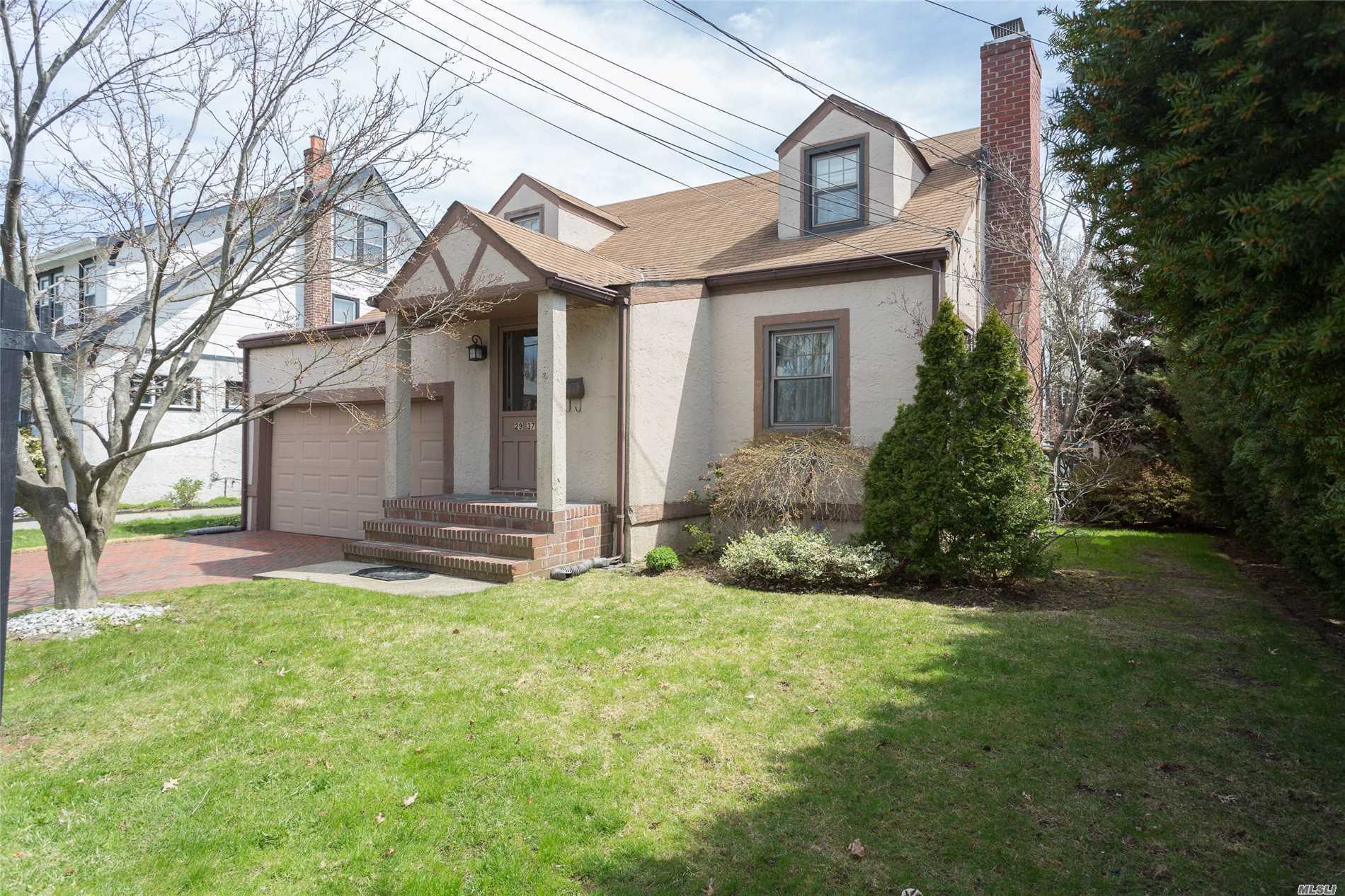 Beautifully Kept 1 Family Detached Cape On Extraordinary Block In Bayside. Large Property, 50X100. 3 Bedrooms, Livingroom With Fireplace, Den, Eat-In-Kitchen, 2 Full Baths. Large Rear Deck Overlooking Above-Ground Pool,  2-Car Garage, Full Basement. Near Schools, Transportation And Restaurants.