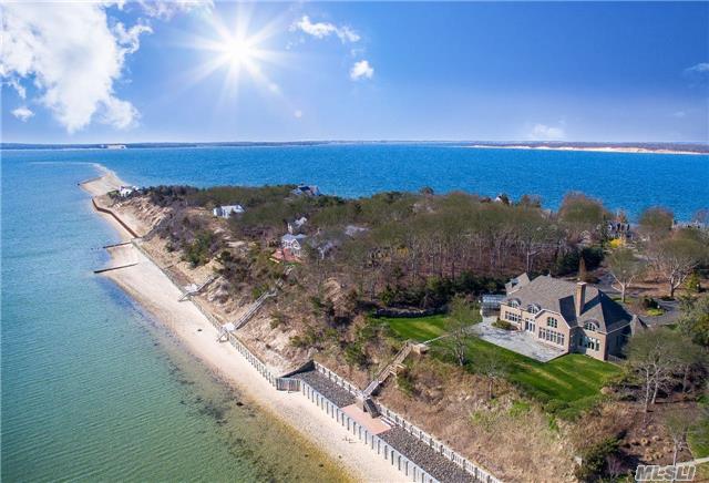 Eastwind A Gracious Brick Nassau Point Bayfront Home Designed By Samuels & Steelman On Two Private Acres Of Richly Landscaped Land, With 200 Feet Of Sandy Beach And New State Of The Art Double Bulk Heading. Quality Materials And Craftsmanship Throughout The 7000 Sf Of Living Space Bathed In Sunlight With Spectacular Water Views Of Peconic Bay From Every Angle.