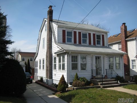 40 X 100 Sunny Single Family Colonial With Detached Garage, Near Ps-107 & Lirr.   3 Bedrooms, 1.5 Bath, New Roof, New Windows, Deck With Brick Patio, Living Room W/Fireplace, Formal Dinning Room.  Hardwood Floors, Updated Kitchen , Breakfast Room,  Full Basement,  Updated Bath W/ Jacuzzi Tub,  Back Porch.  