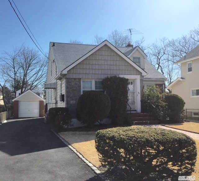 All Brick And Stone 8 Room Expanded Cape,  4 Bedrooms,  2 Baths,  Finish Basement,  Garage,  Walk To Lirr.