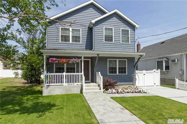 Spectacular Colonial In Bellmore. Everything Has Been Updated From Roof To Floors Within Last 2 Years In This Diamond Condition Turn-Key Home Featuring Top Of The Line Ss Appliances, Granite Counters, Dual Cac, Gleaming Hardwood Floors, Security Surveillance, Electronic Doorbell With Camera , And Docking Rights Just To Name A Few. Pride Of Homeownership Shows.