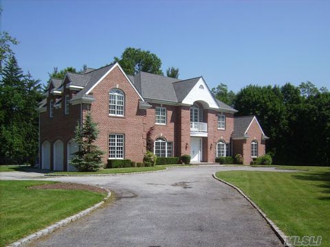 Set At The End Of A Long Private Driveway Is This Elegant Center Hall Colonial In Broadhollow On 2+ Park Like Manicured Acres. This Home Reflects Style & Elegance W/Designer Eik, Formal Lr & Dr, Custom Wood Staircase, Marbel Flrs & Hardwoods Thru-Out.