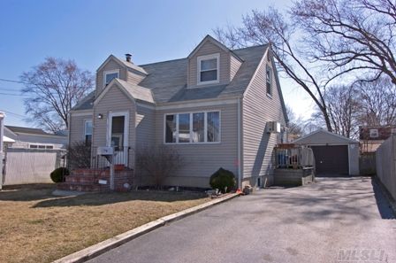 Nice & Neat Cozy Cape Cod On Quiet Street. Updates=siding,Windows,Etc. Spacious 1.5 Car Det Garage, Full Basement, Hw Floors And Low-Low Taxes Make This Home A Winner!