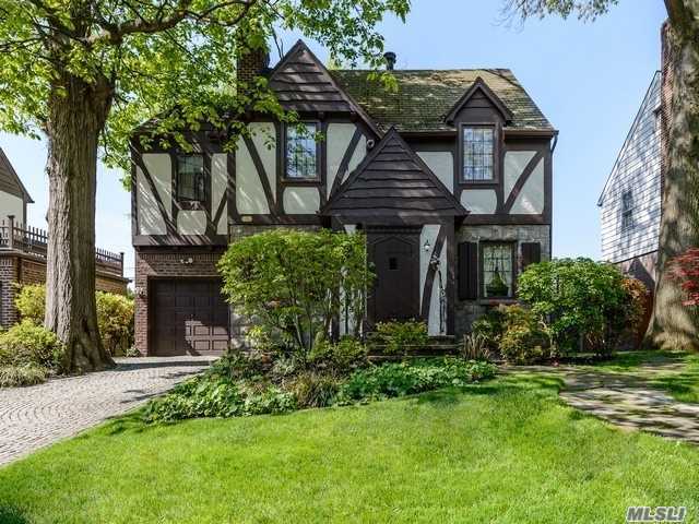 Truly Exceptional & Charming Center Hall Tudor Colonial Situated In A Serene Tree Lined Street, Entry Foyer Opens To Lr, Dr/Wfpl, Eik W/Granite & Top Of The Line Ss Appliances, Family Rmw/Professional Home Theatre, Powder Rm, 2nd Floor Master Suite W/Full Bth, 1 Bdrm W/Fpl & 2 Additional Bdrms, Full Bth, Green House & Porch. Full Finished And Extended Basement W/Gym, Office & Full Bth. Too Much To List Must See! Close To Public Trans To Nyc, Zoned Ps 188