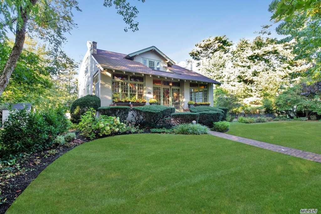 Truly extraordinary & spacious home situated in the heart of Brightwaters Vlg. At over 3000 sq. ft. this unique architectural gem is reminiscent of a historical era. Enter thru a unique patio w/stained glass windows & you will quickly find the generous sized LR w/fireplace & an elegant formal DR w/wide plank floors & high ceilings. A sun drenched den w/French doors leads to an impressively designed patio & yard.Perfect for entertaining both inside & out. Vlg amenities include dock, beach, & tennis