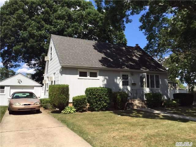 Great Beginnings For This Charming Cape Cod Style Home Situated On 80 X 100 Property In Massapequa Sd# 23. Lite Oak Kitchen, Vinyl Sided Front, Vinyl Replacement Windows Throughout, Hardwood Floors, Updated 150 Amp Electric, Gas Cooking, Dyer & H.W Heater.Huge Yard & Over Sized 1.5 Car Detached Garage, Swing A Paint Brush And Save $$$, Hurry!!