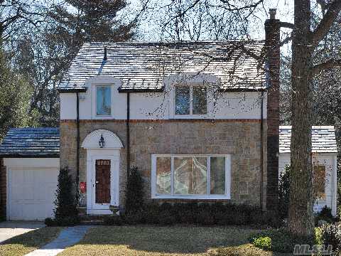 Handsomely Clad In Stone & Brick And With A Slate Roof, This Wonderful Colonial Offers 3 Spacious Brs, 1.5 Baths, Large Eik, Fdr, Lr W/Fireplace And Sunroom. Fabulous Flat Backyard W/New Landscaping And In-Ground Sprinklers. Hardwood Floors, Cac, Great Basement.