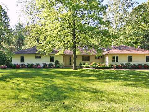 Sprawling Renovated Ranch Style Home Set On Beautifully Landscaped Acre And Offers An Ideal Setting For Easy Entertaining & Family Living.