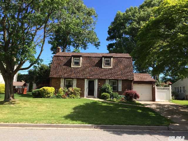 Beautiful Renovated 4 Bedroom Home With Two And Half Bathrooms,  Hardwood Floors Throuout,  And Gourment Kitchen/Granite Countertop. Blocks To Shops And Highways.