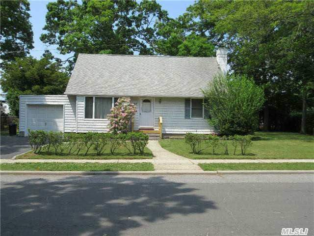 Terrific 4 Bedroom Cape In Desirable Massapequa Park. Beautiful Park-Like Backyard On Oversized Corner Property! Commuters Delight Only 3 Short Blocks From The Lirr. Also Features Vinyl Siding, Young Roof And Hardwood Floors,  Clean Full Unfinished Basement With High Ceilings.