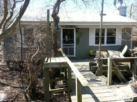 A One Of A Kind....Charming Beach House - There Is A Master Bedroom W/It's Own Bath - A Large Beautiful Sunroom. A Upstairs Deck W/A Glimpse Of The Ocean - Lr Has A Fplc + More....