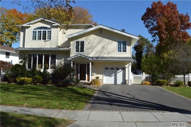 Beautifully Updated And Expanded 4Bedroom 2.5 Bath Split On Oversized Property. Syosset Schools, Master Bedroom Suite With Full Bath.Large Eat In Kitchen With Sliders To Backyard. New Driveway.Igs, Hardwood Floors, New Heating And Cac.Taxes Do Not Reflect Star Exemption.