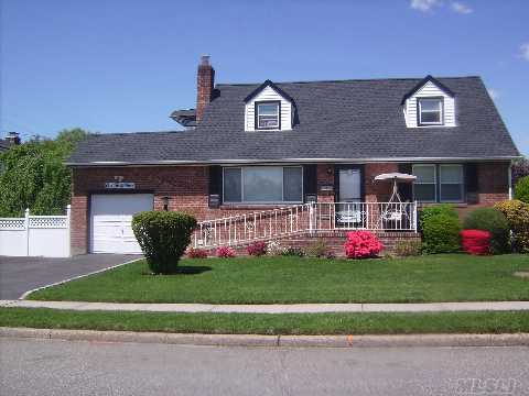 This Beautiful Extra Large Brick Cape, In The Herricks School District, New Brick Stoop, Gutters And Leaders, Roof, Siding, Windows,Wood Flrs, Main Flr Has 2 Large Bedrooms,Lrg Bath, Living Rm,Dining Rm,Second Flr Has 3 Bedrooms,Full Bath, House Has All Fenced In The Yard,1 .5 Garage, Cac, 2 Zone Heating, .5 Dormer In Back, Underground Sprinkler. 4 Car Driveway. 