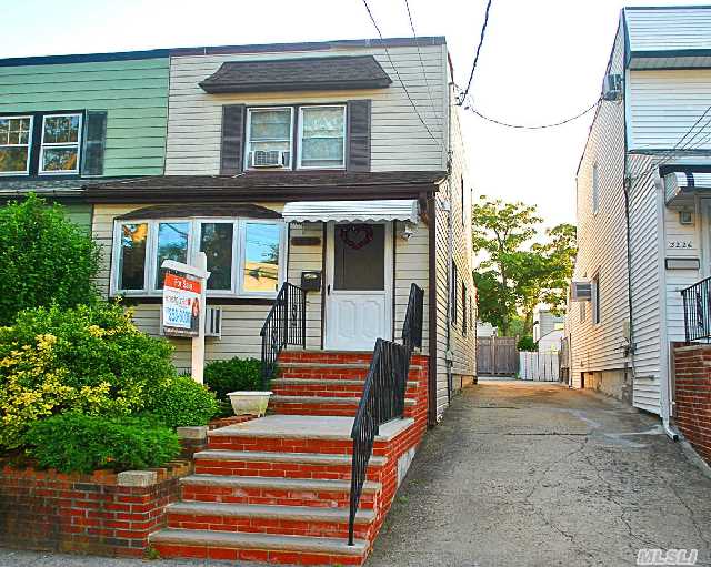 Sun Soaked Eastern Exposed Semi Det Colonial In Prime Bayside Location. Feat Lr,  Fdr,  Ext Eik W/ 1/2 Bath On 1st Flr. 3 Bedrooms,  Full Bath Upstairs Plus A Fin Basement W/ Marbled Floor & Full Bath. Young 2 Zone Gas Heat,  Deck Off Kitchen & Parking Space In Rear. Near Schools,  Shops & Trans.     P.S. 159 & I.S. 25