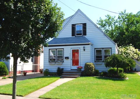 Charming Updated Cape Features 4 Bedrooms, 2 Baths, Formal Living Room, New Eat-In-Kitchen, Finished Basement With Playroom, Laundry And Utility Room.  This Home Has Hardwood Floors, New Roof, Windows, Central Air Conditioner And Inground Sprinklers.