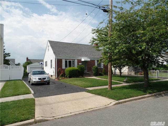 Lovely Brick And Vinyl Sided Home. Cabinet Lined Eat In Kitchen, Spacious Living Room, 4 Sun Swept Bedrooms, Finished Basement, And Garage. Fenced In Grounds. Gas Heat Close To All Schools, Shopping And Lirr.