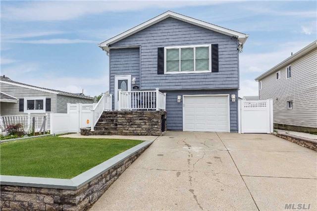 Must See! Totally Redone From The Studs Up Hi Ranch 1 Block From The Beach With Granite Kitchen And Vaulted Ceilings! All New Electric, 22 New Windows, On Demand Hot Water And So Much More! Unlike Any Other House In The Neighborhood!