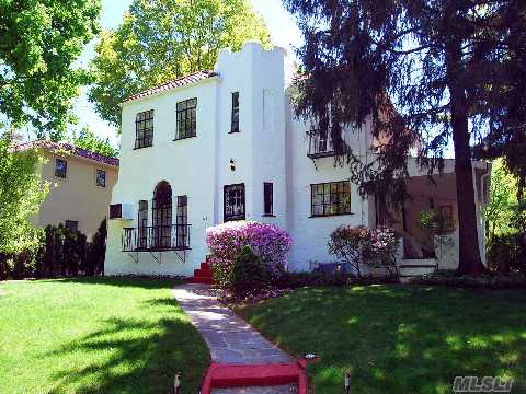 4 Bedroom 2 Bath Mediterranean Colonial.  Dramatic 2 Story Living Room With Stone Fireplace.  Ajacent Is A Huge Porch.  The Formal Dining Room Has A Floor To Ceiling Palladium Window.  The Eat-In-Kitchen Has Sliding Doors That Lead To A Stone Patio. There Are 2 Terraces Off The Bedrooms. There Is A 2 Car Detached Garage. With A Little Tlc, This Can Be Your Dream Home!