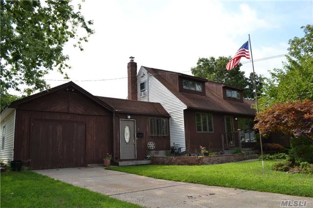 Located In Lovely Neighborhood Is This Great Opportunity To Own This Expanded Cape With Much Potential,  Hrdwd Flrs, Many Andersen Windows, Full Basement,  Enclosed Sunroom Leads To Rear Wood Deck, Breezeway, Fenced Yard, East Islip Sd