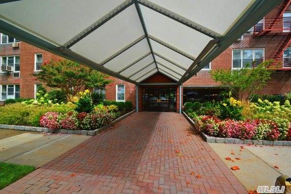 Extra Large 900 Sq. Ft. Jr.4/One Bedroom With Small Second Den/Office. Pristine Condition Throughout~super Location/ Across From Bay Terrace Shopping Center, Minutes To The Lirr/ Qm2 Express Bus To City And Q28 Close By. Evening Security, Tennis Court And New Gym On Premise. Reserved Parking Ownership Included In The Sale.