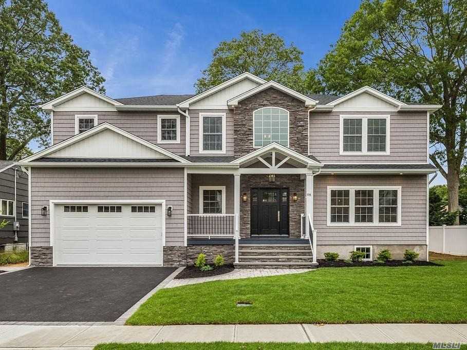 ELITE CUSTOM COLONIAL sits mid-block on wide, tree-lined street in heart of The Village. Expertly-designed NEW home on large prop is totally turn-key complete W/a designer eat-in kitchen well-complemented by under cabs/counter lights, a pot filler above gas SS stove, supersized farm sink, 9&rsquo; island, & an open-flow into: DiningRm, LivingRm, & FamRm w/coffered ceiling+gas fplc. Add&rsquo;l Features= Gorg Lscaping+UG Sprnk+Paver Patio+Fin Bsmt+Pella Wdws+Steam Shwr w/BodySprays+WALK to RR/TOWN, +MuchMore!