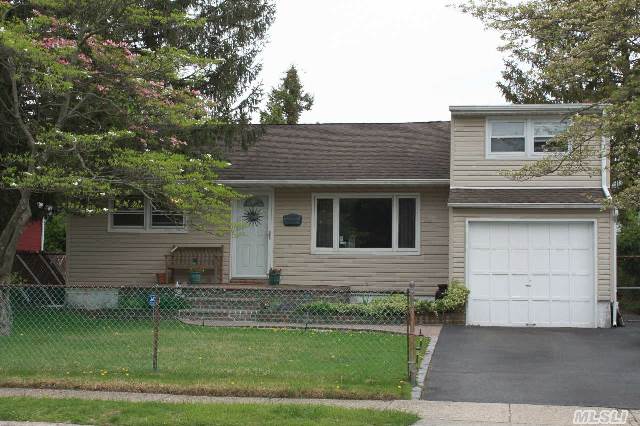 This Lovely Home  Has Three Good Size Bedrooms,  An Updated Kitchen And Bath,  And A Finished Sliding Doors To A Large Deck For Entertaining,   Finished Basement,  Sep. Hot Water Heater.  Fenced Yard And An Attached Garage.