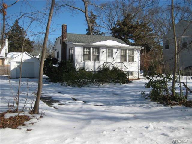 Large, Flat Property In Quiet, Tree Lined Neighborhood With Deeded Beach Rights And Detached Garage! Garage Door And Roof On Garage And House Was Replaced In 2013. House Has Loads Of Potential But Needs Tlc.