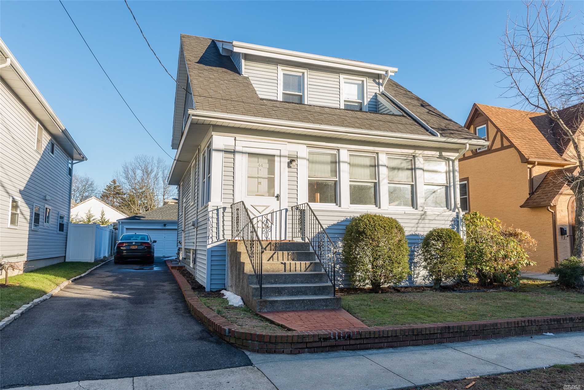 Legal 2 Family Currently Set-Up As A Single Family Colonial With One Kitchen, 3Br Full Bath Over Enclosed Porch, Lr, Fdr, Eik W/Gas Stove, Den & Full Bath. Located Only Minutes From Shopping, Dining, And Lirr. Legal 2 Set-Up 1 Over 2 Bedroom. Full Unfinished Basement Cellar (W/D & Utilities), Plus Attic, 2.5 Car Garage Offer Excellent Storage.
