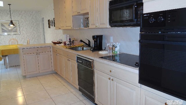 Corner Unit With Master Suite On Main Floor. Plenty Of Sunlight With Great Potential. Won't Last-Priced Aggressively.