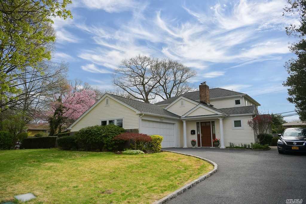 Rarely do you find a 4 BR, 3 Bath Colonial in Roslyn Country Club with LOW Taxes on 1/3 Acre that is Beautifully Renovated & Spacious. This golden Gem has a Master BR Suite on the 1st Fl,  Great Entertainment Flow w/ Dual Sided WBFPL, Large/Bright EIK, Sunny LR, DR & Den. Features Include Radiant Heat, CAC , IGS, proximity to Middle School in the Famed East Williston/Wheatley School District . A GOLDEN GREAT!