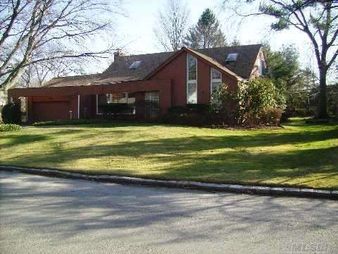 Sunny & Spacious Contemporary In Mint Condition, Located In The Most Prestigious Village Of Saddle Rock. Open Floor Plan With L-Shaped Lr, Large Dr And A Den W/Vaulted Ceiling. 5Br, 3Ba, Finshd Bsmt W/Guest Br & Full Bath. Large Manicured Property W/A Deck & Brick Patio. Convenient To All.