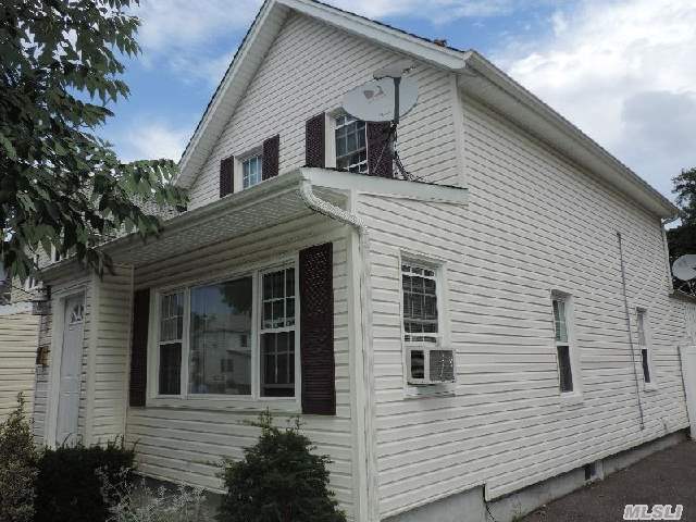 Mid Block Colonial/Close To Lirr..Nice Size Rooms..New Front Stoop, 2 New Baths..New Roof, Windows, Vinyl Siding, Kitchen,  Gas Burner & Water Heater (New Plumbing In Basement) Must See