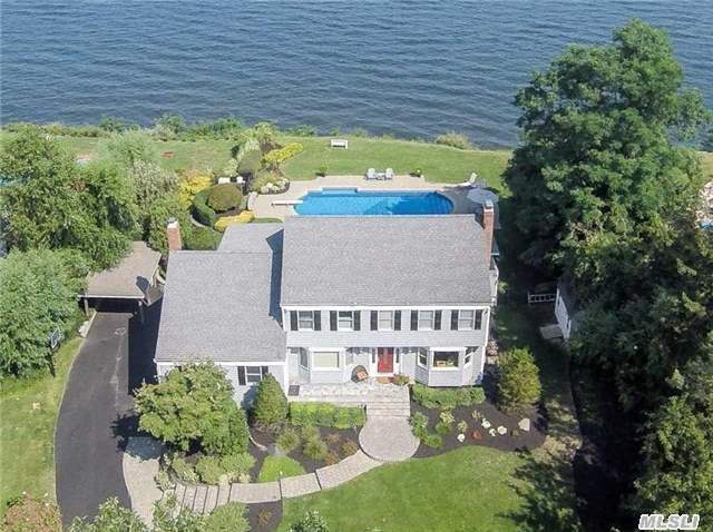 This Stunning Waterfront Colonial Offers 100 Mile Views Of The Long Island Sound!! With Over 100 Feet Of Beachfront, This Home Boasts Two Fireplaces, Beautiful Hardwood Floors, Gourmet Kitchen, And Magnificent Great Room Perfectly Designed For Entertaining With 1.4 Acres Of Park-Like Grounds With Expansive Deck, Covered Outdoor Bar, And Inground Pool. Taxes W/Star $22, 977.