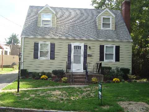 Charming Cape In Excellent Condition With Detached Garage On Dead End Street, New Paint, New Carpet,New Kitchen Floor, Hardwood Floors Re-Done Plus New Landscaping-Estate Sale.