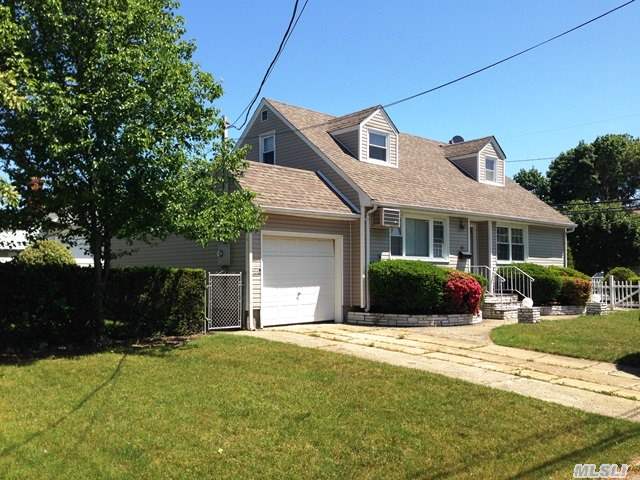 Beautiful & Spacious Wide-Line Cape In Plainedge School #18. 5 Bedrooms,  Oak Hardwood & Laminate Flooring Throughout,  New Eat-In Kitchen W/Dinette,  Granite Tile & Stainless Appliances,  2 Updated Baths,  Huge Finished Basement Great For Entertainment W/Lots Of Storage,  Updated Windows,  Roof,  Vinyl Siding,  A Quiet Corner Property With 2 Large & Fully-Fenced Side Yards.