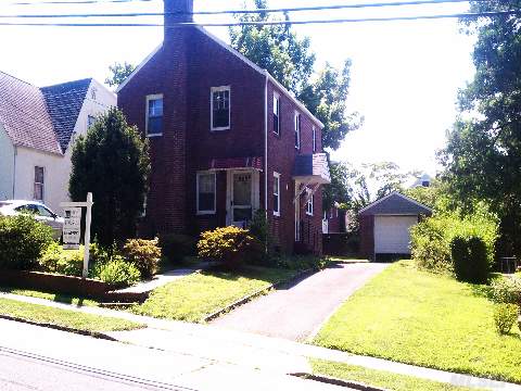 New Roof, New Paint, New Floors, Move Right In, Classic Brick Colonial With Fireplace And Detached Garage.