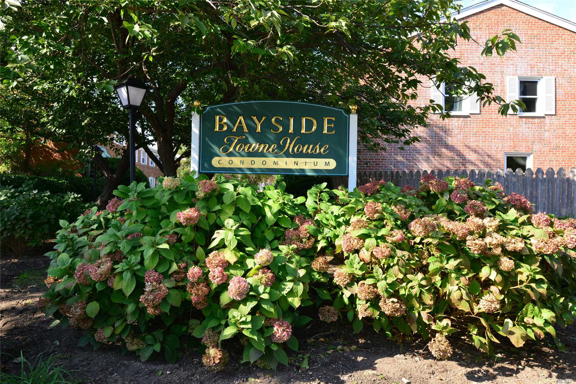 Townhouse Style Condominium In The Heart Of Bayside. 3 Bedrooms, 2.5 Baths (Master Bedroom With Full Bath). Wonderful Layout With Large Eat In Kitchen, Dining Room, Living Room, 2 Full Baths Upstairs. Full Finished Basement, High Ceilings, Laundry Room With Newer Washer And Dryer, Wet Bar.Many Windows Are New, Private Yard, Hardwood Floors Underneath All. Assigned Parking Spot. Pets Allowed.