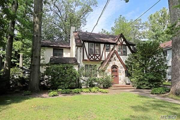 Spacious 5 Bedroom 3 Full Bath Tudor. Huge Living Room with a Fireplace, Formal Dining Room, Sky Lit Eat In Kitchen, Large Den and Library. A Full Bath and Laundry Complete the First Floor. The Den could be a first floor Master Bedroom. There are 4 Family Bedrooms. The Master Suite had the 5th Bedroom Added to it. The Partial Basement is Partially Finished with an Outside Entrance. The Private Backyard has a Large Brick Patio There is a 1.5 Car Detached Garage. Heating System 2 years old.