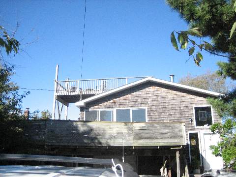 This Private Charming Gated Community Offers Excellent Views Of Fire Island Inlet From The Upper Level Decking Along With Beaches/Boating For Your Enjoyment! Home Offers Open Sundrenched Flr Plan W/Hwd Flrs,  Loads Of Potential & Private Year Round Living. *Subject To Bank Approved Short Sale* Land Lease Till 2050,  Sold 'As Is'.