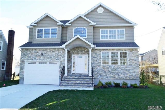 Magnificent Brand New Construction Colonial. This One Of A Kind Home Features Remarkable Architectural Work. Beautiful Kitchen, Living Rm, Dining Rm, Family Rm W Fireplace, 4 Bedrooms, Master Suite With A Master Bath,  2 More Full Baths, 2 Car Attached Garage. Great Mid Block Location. Taxes And Property Info Shall Be Verified By Buyers With Local Municipalities.