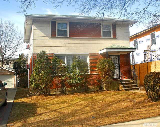 Perfectly Preserved Side Hall Colonial Featuring Large Living Room,  Formal Dining Room,  Squared Kitchen With Seating,  3 Ample Bedrooms With 2.5 Updated Baths. Finished Basement,  Set On Quiet Tree Lined Street. 1.5 Car Garage,  Large Yard,  40X100. Priced To Move. P.S.162 & J.H.S. 074