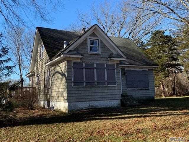 Step Back In Time And Envision What This Once Charming Home Had To Offer! Large Kitchen With Eat In Area, 3 Nice Size Bedrooms. Large Corner Lot With Expansive Deck For Outside Entertaining. Large Oversized Garage To Store All Those Toys. Just A Few Minutes To Main Street Where You Can Enjoy Restaurants And Shopping. You Need To See This Home To Appreciate All It Has To Offer!