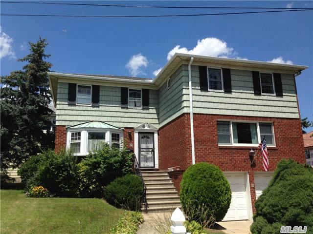 Large Corner Lot Of Central-Hall Colonial In Bayside North. Spacious Rooms Throughout. Walk-To Lirr Station And One-Block To Northern Blvd. Near Bus Stop #12 And Shops. Excellent School District #26. Great For Big Family And Professional.