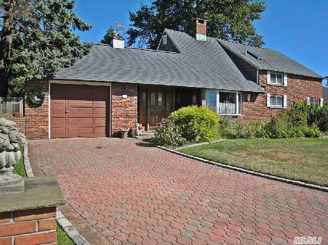 Extended,  Dormered,  Custom Built Brick Charmer Set On Park Like Grounds! Gas Heat In Work Basement! Separate Formal Dining. Ext. Sitting Room Beyond Orig. Living Rm. Open,  Airy Floorplan W Vaulted Ceilings & Skylites! Humongous 100X136 Park-Like Lot With I.G. Sprinklers & Potting Shed/Workshop. Family Friendly Locale. Ready For You!