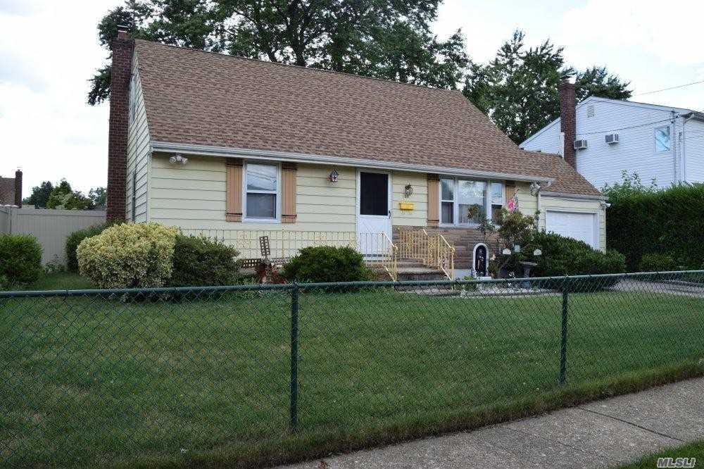 Here&rsquo;s A New Englander Just Looking For Some New Owners ! How About Brand New Roof, Leaders, Gutters, Pvc Fence And More ! This Home Also Comes With A Fully Finished Basement, Two Full Bathrooms, Formal Dining Room, Attached Garage, Hardwood Floors Under The Carpets, Fully Fenced Property & More !