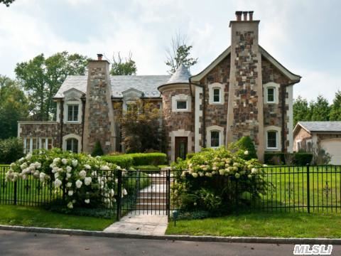 Magnificent Story Book Tudor Built W/Superior Craftsmanship With Large Lr,  Banquet Sz Dinning Rm,  Den,  Eik,  4 Bedrooms And 4.5 Bths. This Is One Of A Few Homes In The Area That Is Connected To The Sewer System.