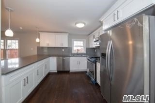 Totally Renovated Colonial-Rebuilt From The Studs Out-Like New! Open Floor Plan, Custom Cabinets With Quartz Counter Tops, Wood Floors Throughout. Den With Fireplace.New Bathrooms & Appliances.Cathedral Ceilings, Hi-Hat Lighting.No Disappointment! Must See To Appreciate!