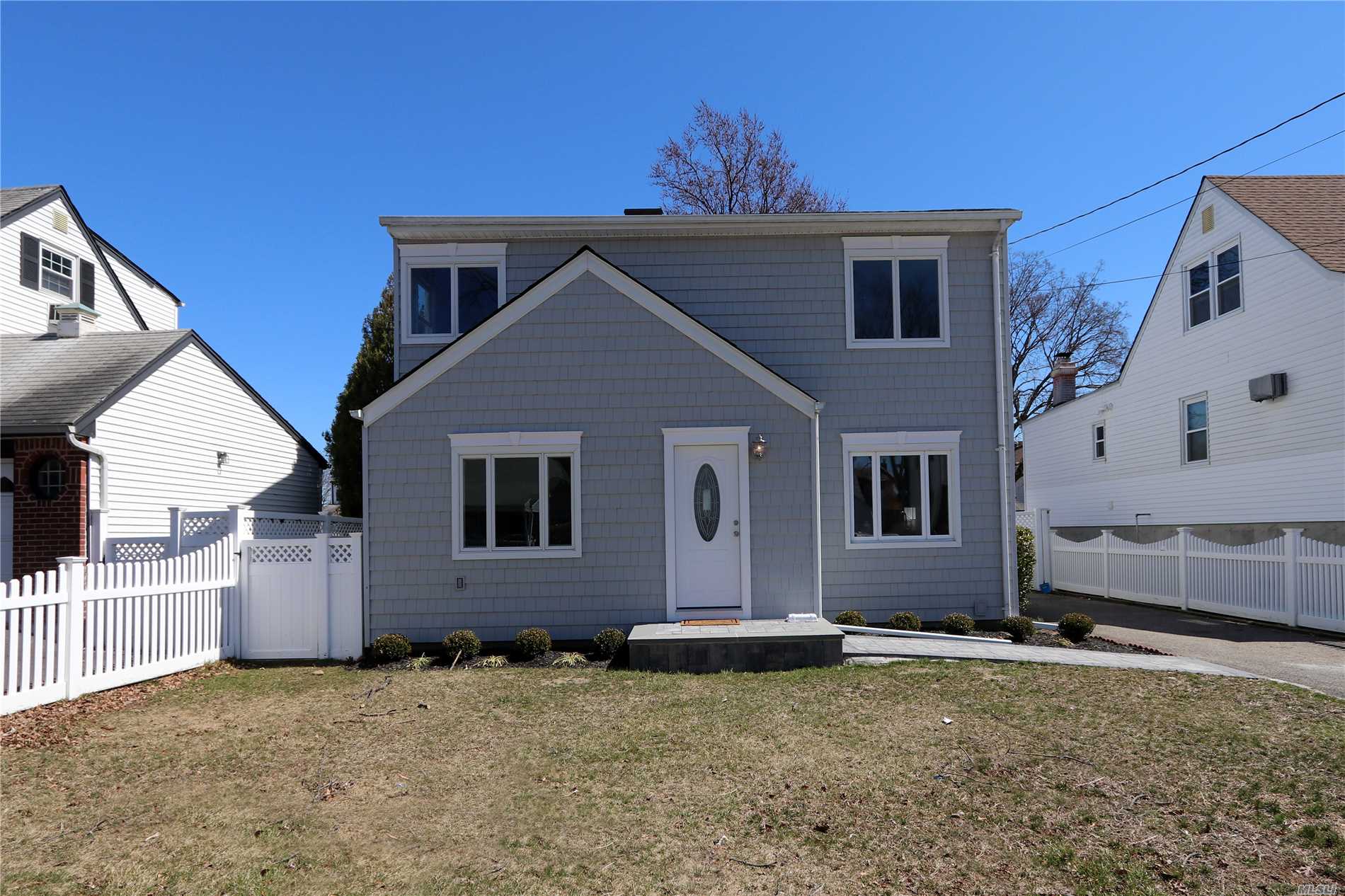 Beautiful renovated 4 BR colonial in South Seaford. This home features an Open Concept, beautiful kitchen with grunite counters stainless steel appliances hardwood floors, new bathrooms and Trex Deck. House is Move-In ready. Flood Zone AE -- All you need to do is unpack!!