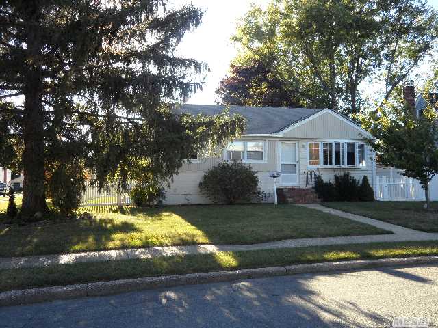 Beautiful And Freshly Painted Ranch Home Is Close To All In Syosset With 2-Car Detached Garage,  Full Finished Bsmt,  And Backyard Deck For Outdoor Entertaining!  Features Include New Full Bath,  New Fencing,  New Doors,  New Carpeting,  And Much More! Taxes Shown Are Without Star Exemption Of Approx $1330